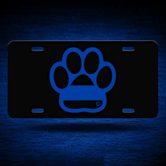 Blue Line Dog Paw License Plate — floating presentation on blue textured backdrop
