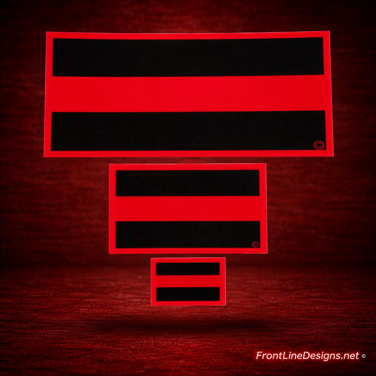Red Line reflective decals, three-size comparison, on matching red textured background — replacement preview for approval