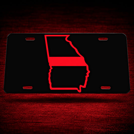 Georgia State Red Line Reflective License Plate — floating product on red textured backdrop